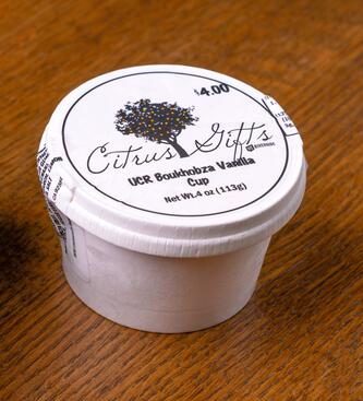 UCR Boukhobza Vanilla Ice Cream Cup on a wooden table.